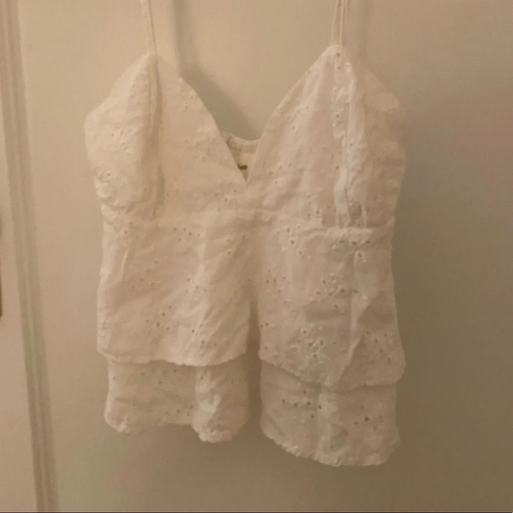 Eyelet crop top with slight peplum - Picture 1 of 3